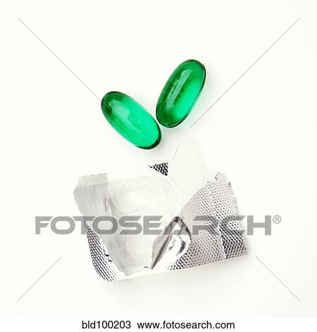 Stock Image - Two capsules and open blister pack. Fotosearch
