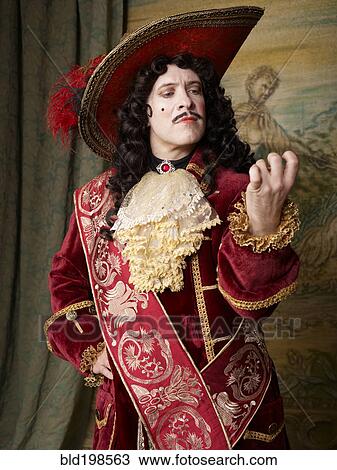 Stock Image - Actor dressed in old-fashioned costume on stage. Fotosearch
