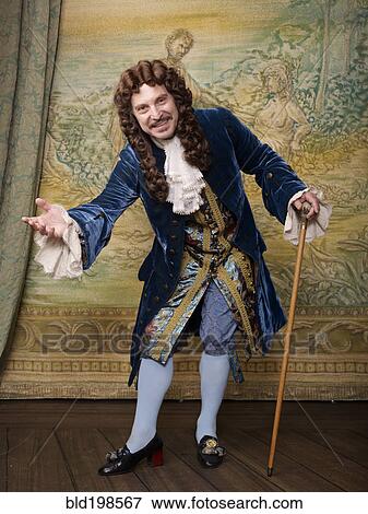 Actor dressed in old-fashioned costume on stage View Large Photo Image Stock Photo - Actor dressed in old-fashioned costume on stage. Fotosearch