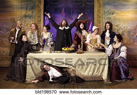 Stock Image - Actors in old-fashioned costumes on stage. Fotosearch
