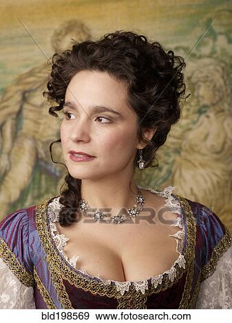 Stock Photo - Actress dressed in old-fashioned costume on stage. Fotosearch