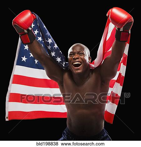 Stock Photo - African American boxer holding American flag. Fotosearch