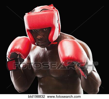 Stock Image - African American boxer in protective gear. Fotosearch