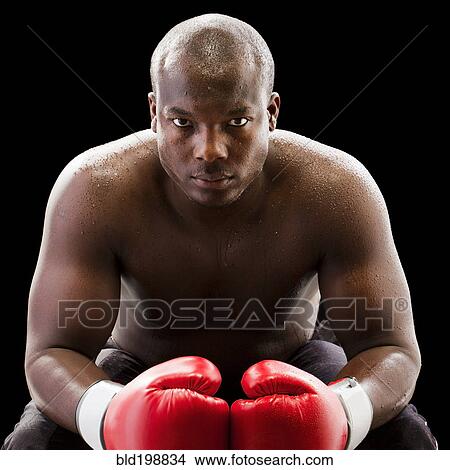 Picture - African American boxer wearing boxing gloves. Fotosearch