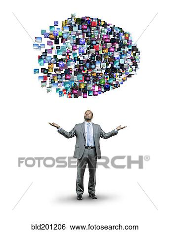 Stock Photograph - African American businessman underneath cloud of technology images. Fotosearch