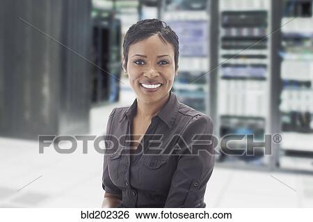 African American businesswoman in server room View Large Photo Image Stock Photograph - African American businesswoman in server room. Fotosearch