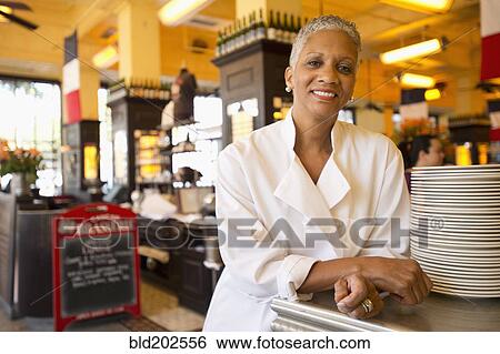 Stock Photograph - African American chef in cafe. Fotosearch