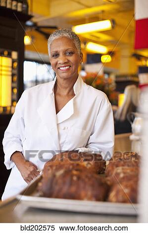 Stock Photography - African American chef in cafe. Fotosearch