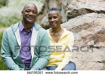African American couple sitting in park View Large Photo Image Stock Image - African American couple sitting in park. Fotosearch