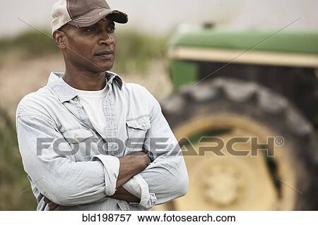 Stock Photo - African American farmer with arms crossed. Fotosearch