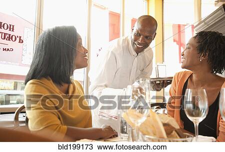 African American friends having lunch in restaurant View Large Photo Image Stock Image - African American friends having lunch in restaurant. Fotosearch