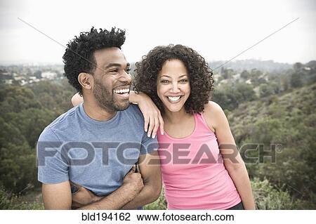 Stock Image - African American man and his girlfriend in remote area. Fotosearch