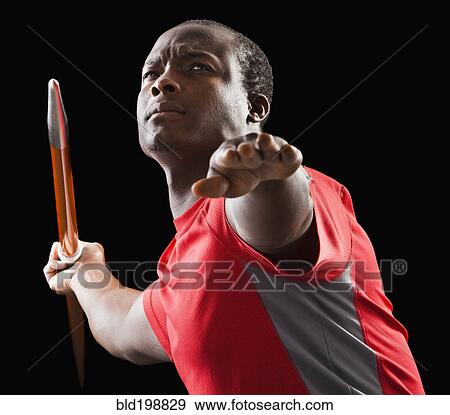 Stock Photo - African American man holding track and field javelin. Fotosearch