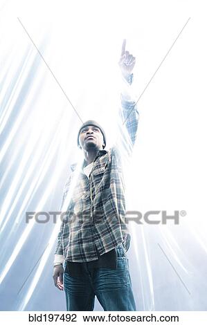 African American man pointing at light spark View Large Photo Image Stock Image - African American man pointing at light spark. Fotosearch