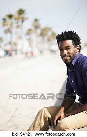 African American man sitting outdoors View Large Photo Image Stock Image - African American man sitting outdoors. Fotosearch