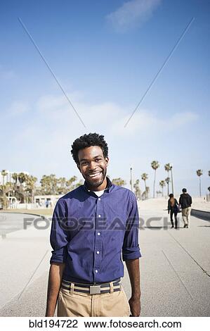 African American man standing outdoors View Large Photo Image Stock Image - African American man standing outdoors. Fotosearch
