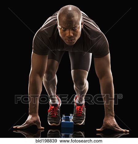 African American runner crouching at starting block View Large Photo Image Stock Photo - African American runner crouching at starting block. Fotosearch