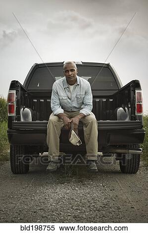 African American sitting on back of pick-up truck View Large Photo Image Stock Photography - African American sitting on back of pick-up truck. Fotosearch