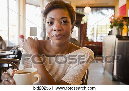 African American woman drinking coffee in cafe View Large Photo Image Stock Image - African American woman drinking coffee in cafe. Fotosearch