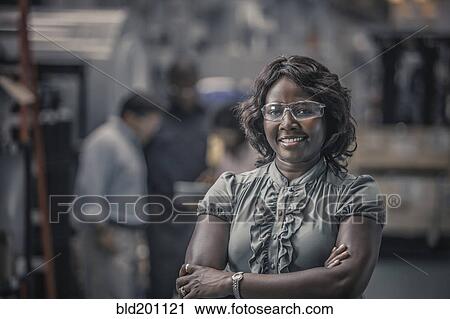African American worker standing in factory View Large Photo Image Stock Image - African American worker standing in factory. Fotosearch