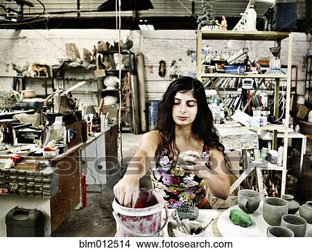 Artist working in pottery studio View Large Photo Image Picture - Artist working in pottery studio. Fotosearch