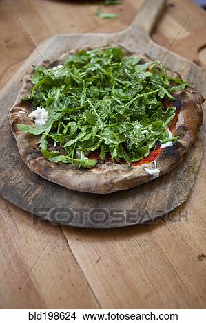 Arugula lettuce topping on pizza View Large Photo Image Picture - Arugula lettuce topping on pizza. Fotosearch