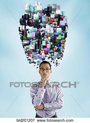 Asian businessman underneath cloud of technology images View Large Photo Image Stock Photo - Asian businessman underneath cloud of technology images. Fotosearch