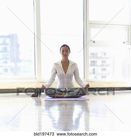 Asian businesswoman practicing yoga on office floor View Large Photo Image Stock Image - Asian businesswoman practicing yoga on office floor. Fotosearch