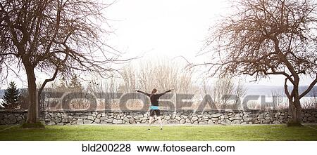 Asian woman exercising in park View Large Photo Image Stock Photo - Asian woman exercising in park. Fotosearch