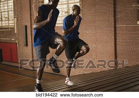 Basketball players running on bleachers View Large Photo Image Stock Image - Basketball players running on bleachers. Fotosearch