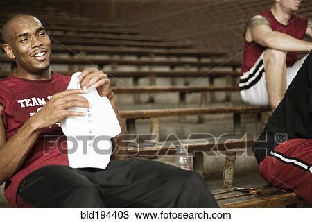 Basketball players sitting in bleachers View Large Photo Image Stock Image - Basketball players sitting in bleachers. Fotosearch
