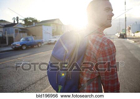 Stock Photograph - Bicycle messenger on city street. Fotosearch