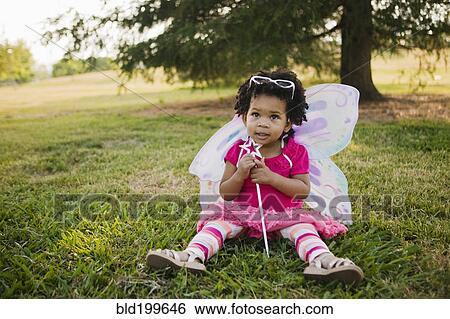 Black baby girl in fairy costume in park View Large Photo Image Stock Photograph - Black baby girl in fairy costume in park. Fotosearch