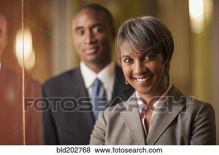 Stock Photo - Black business people smiling. Fotosearch