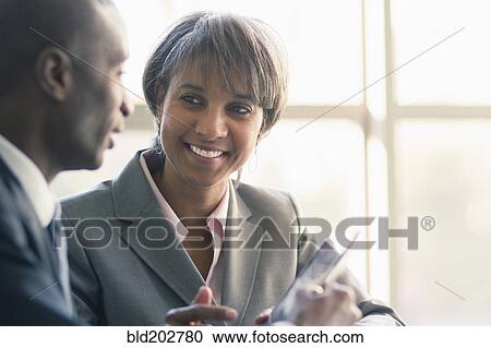Stock Image - Black business people talking. Fotosearch