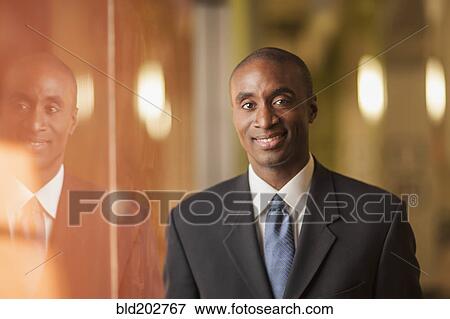 Black businessman smiling View Large Photo Image Stock Photo - Black businessman smiling. Fotosearch