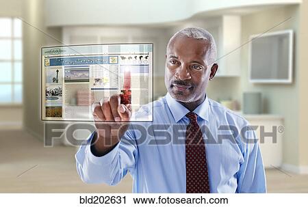 Black businessman using digital display in office View Large Photo Image Stock Image - Black businessman using digital display in office. Fotosearch