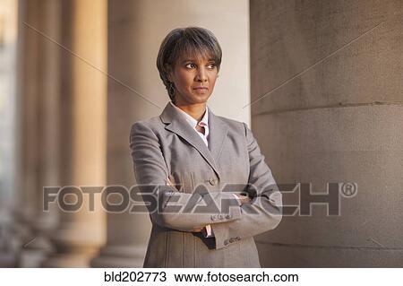 Stock Image - Black businesswoman outdoors. Fotosearch
