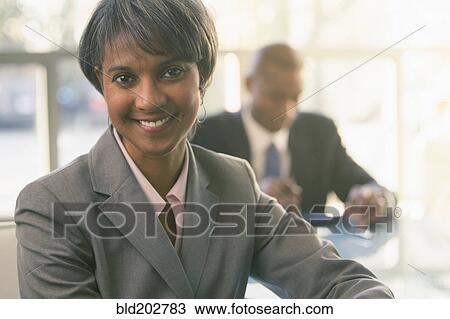 Stock Image - Black businesswoman smiling. Fotosearch