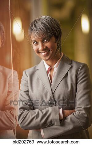 Stock Photo - Black businesswoman smiling. Fotosearch