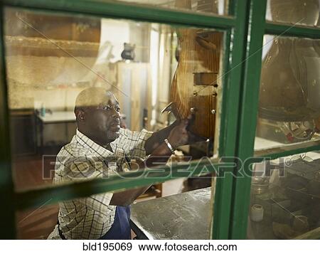 Black lute maker in workshop View Large Photo Image Stock Photo - Black lute maker in workshop. Fotosearch