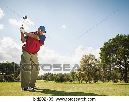 Stock Image - Black man playing golf. Fotosearch