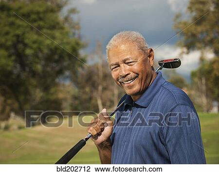 Black man playing golf View Large Photo Image Stock Image - Black man playing golf. Fotosearch