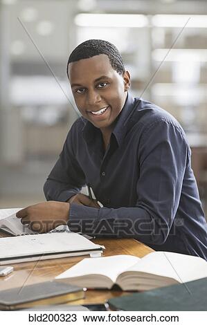Black man studying View Large Photo Image Stock Image - Black man studying. Fotosearch