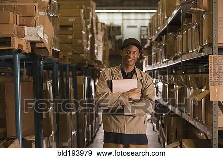 Stock Photo - Black man working in warehouse. Fotosearch
