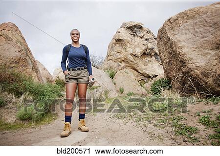 Black woman hiking in remote area View Large Photo Image Stock Image - Black woman hiking in remote area. Fotosearch