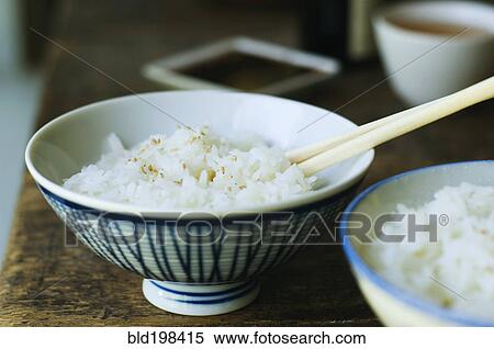 Bowl of rice and chopsticks View Large Photo Image Stock Photography - Bowl of rice and chopsticks. Fotosearch