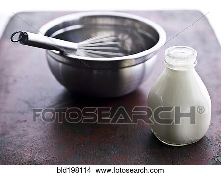 Picture - Bowl, wire whisk and milk in bottle. Fotosearch
