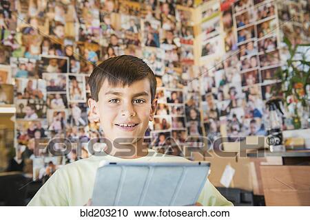 Stock Image - Boy having hair cut in salon. Fotosearch