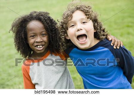 Stock Photo - Boys smiling in park. Fotosearch